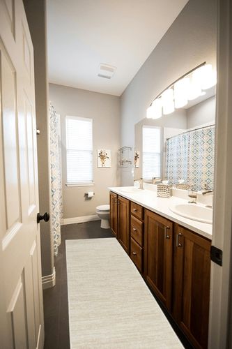 Nourison Essentials Solid Contemporary Ivory Beige, Runner Rug, 2'2" x 7'6" in Wooden and Grey Bathroom