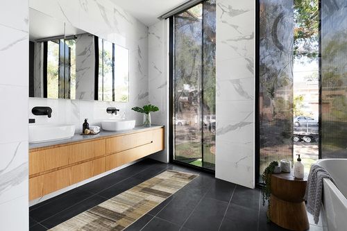 HomeRoots 8' Beige Charcoal Brown Grey Tan Gold and Blue Geometric Power Loom Runner Rug with Fringe in Modern Black Tiled bathroom