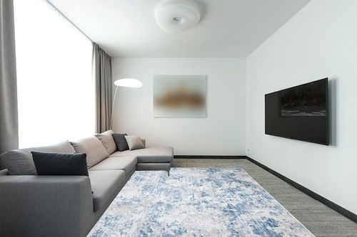 SAFAVIEH Amelia Collection Area Rug - 8' x 10', Grey & Blue, Modern Abstract Design, Non-Shedding & Easy Care, Ideal for High Traffic Areas in Living Room, Bedroom (ALA705F) in Modern Living Room with Grey Couch