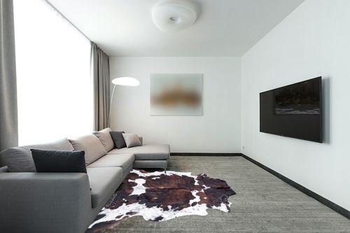 rodeo Genuine Cowhide Rug: Hand-Picked & Authentic Real Cowhide Rug for Country Home Decor - Cow Hide Rug Large Sized at 6x7ft - Cozy, Unique, Durable, Leather Cow Carpet Rugs - Brindle Nutella in Modern Living Room with Grey Couch