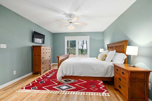 SAFAVIEH Farmhouse Collection 8' x 10' Red/Gold FMH599Q Moroccan Boho Tassel Area Rug in Teal and Orange Wood Bedroom