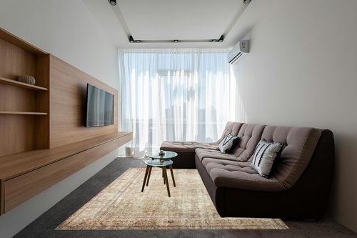 Loloi II Margot Collection MAT-01 Antique/Sage 7'-6" x 9'-6" Area Rug feat. CloudPile in Grey Living Room with Brown Couch
