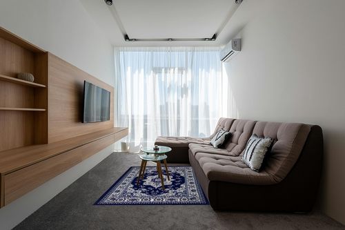 Antep Rugs Alfombras Oriental Traditional 5x7 Non-Skid (Non-Slip) Low Profile Pile Rubber Backing Indoor Area Rugs (Navy Blue, 5' x 7') in Grey Living Room with Brown Couch