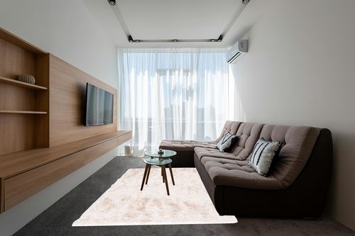 Shag Collection 6' x 9' Ivory in Grey Living Room with Brown Couch