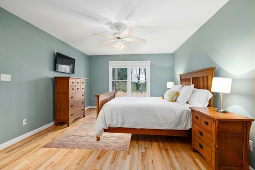 Loloi II Layla Collection LAY-17 Pink/Lagoon, Traditional 5'-0" x 7'-6" Area Rug in Teal and Orange Wood Bedroom