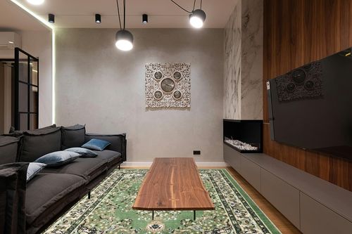 Black Traditional Stain Resistant Dining Room Area Rug in Dark Wood Living Room with Black Couch