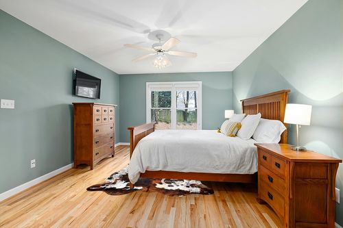 Prime Cowhides Cowhide Rug Tricolor Genuine Hair on Hide Size: Medium (5ft x 6ft) (150cm x 180cm) in Teal and Orange Wood Bedroom