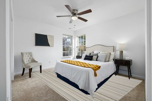 Garland Rug Carnival Stripe 9 Ft. x 12 Ft. Earth Tone Area Rug in White and Yellow Modern Bedroom