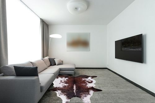 Faux Fur Cowhide Rug 5.6 x 7.3 ft, Cow Print Area Rug Cute Animal Printed Carpets for Bedroom Living Room Rustic Western Home Decor, No Shedding and Easy to Clean in Modern Living Room with Grey Couch