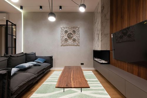 SAFAVIEH Adirondack Collection Area Rug - 6' x 9', Sage & Cream, Modern Wave Distressed Design, Non-Shedding & Easy Care, Ideal for High Traffic Areas in Living Room, Bedroom (ADR125X) in Dark Wood Living Room with Black Couch