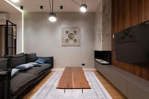 SAFAVIEH Tucson Collection Area Rug - 6' x 9', Beige & Light Green, Persian Design, Non-Shedding Machine Washable & Slip Resistant Ideal for High Traffic Areas in Living Room, Bedroom (TSN184B) in Dark Wood Living Room with Black Couch