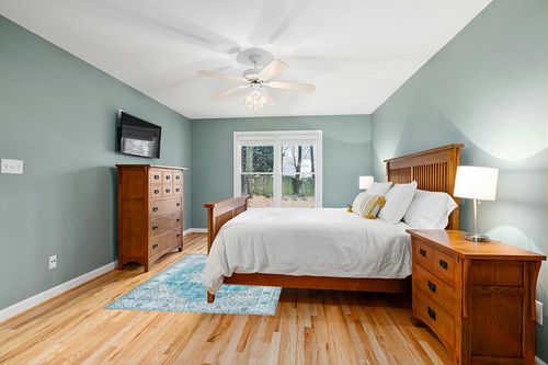 DECOMALL Kalina Washable Area Rugs in Teal and Orange Wood Bedroom