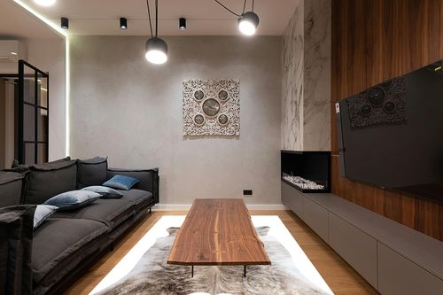 Genuine Light Grey Beige Brindle Cowhide Rug XL 6 x 7-8 ft. 180 x 240 cm in Dark Wood Living Room with Black Couch