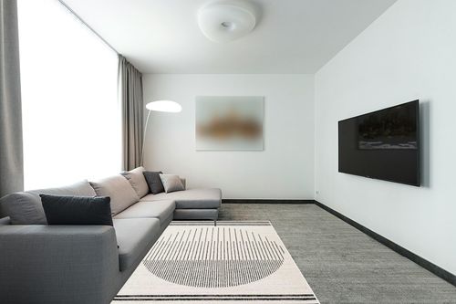 Hauteloom Angus Contemporary Bedroom Living Room Farmhouse Area Rug - Art Deco Boho Carpet - Mid Century Round Southwestern - Native American - Black, Grey, Off White, Beige - 5' x 7' in Modern Living Room with Grey Couch