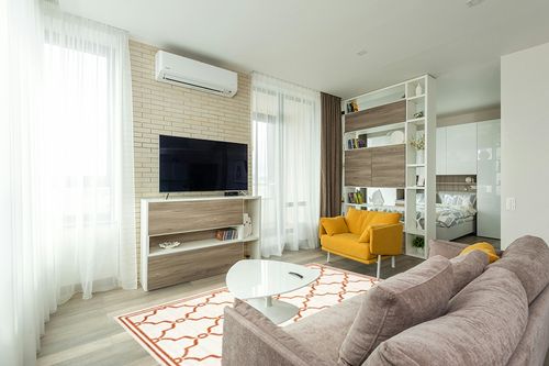 SAFAVIEH Amherst Collection Area Rug - 5'3" x 8', Beige & Orange, Trellis Design, Non-Shedding & Easy Care, Ideal for High Traffic Areas in Living Room, Bedroom (AMT414F) in Light Modern Living Room with TV