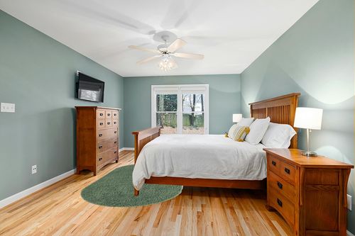 5x8 Oval Green fluffy rug in Teal and Orange Wood Bedroom