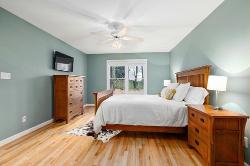 MustMat Faux Cowhide Rug Black and White Cow Print Area Rug Large Animal Hide Carpet Western Decor 5.2ft x 6.6ft in Teal and Orange Wood Bedroom