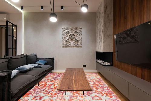 SAFAVIEH Madison Collection Area Rug - 8' x 10', Orange & Ivory, Boho Distressed Design, Non-Shedding & Easy Care, Ideal for High Traffic Areas in Living Room, Bedroom (MAD444P) in Dark Wood Living Room with Black Couch