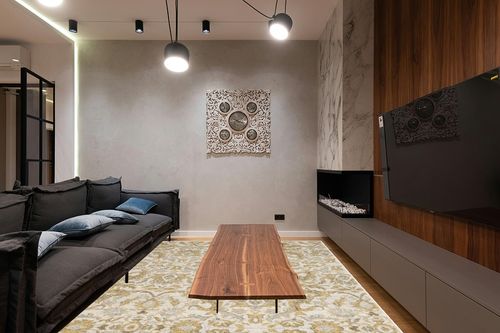 SAFAVIEH Evoke Collection Area Rug - 9' x 12', Ivory & Gold, Shabby Chic Oriental Design, Non-Shedding & Easy Care, Ideal for High Traffic Areas in Living Room, Bedroom (EVK238S) in Dark Wood Living Room with Black Couch