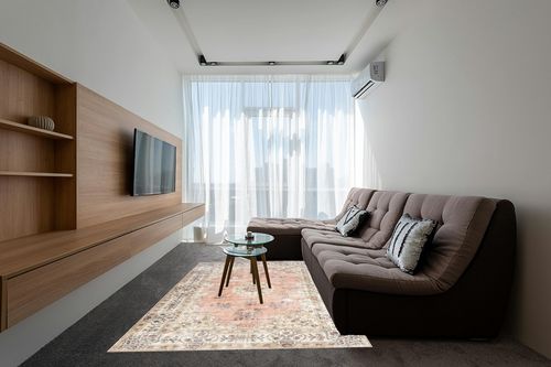 nuLOOM Ren Vintage Floral Machine Washable Area Rug, 6x9, Peach in Grey Living Room with Brown Couch