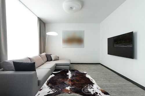 Sunshine Cowhides Genuine Brindle Dark Tricolor Cowhide Rug - Luxurious Cow Rug for Bedroom, Living Room, and Home Decor Enthusiasts - Masterpiece of Style and Functionality - 6x6-7ft (180x210cm) in Modern Living Room with Grey Couch