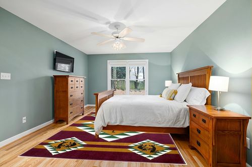 AllStar Rugs Red 8x10 Tribal Area Rug (7' 7" x 10' 6") in Teal and Orange Wood Bedroom