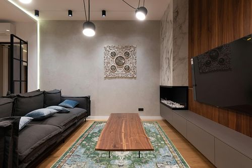 SAFAVIEH Madison Collection Area Rug - 6' x 9', Green & Turquoise, Boho Chic Medallion Distressed Design, Non-Shedding & Easy Care, Ideal for High Traffic Areas in Living Room, Bedroom (MAD473Y) in Dark Wood Living Room with Black Couch