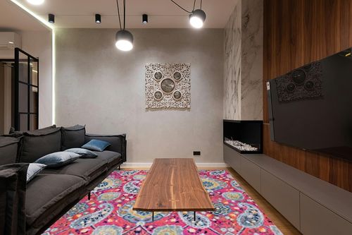 SAFAVIEH Madison Collection 9' x 12' Fuchsia Gold MAD600A Boho Chic Glam Paisley Non-Shedding Living Room Bedroom Dining Home Office Area Rug in Dark Wood Living Room with Black Couch