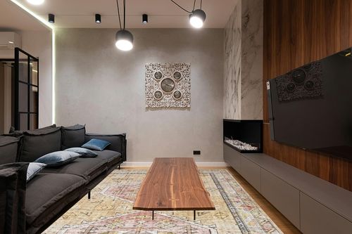 Loloi II Skye Collection SKY-04 GOLD / BLUSH, Traditional 9'-0" x 12'-0" Area Rug in Dark Wood Living Room with Black Couch