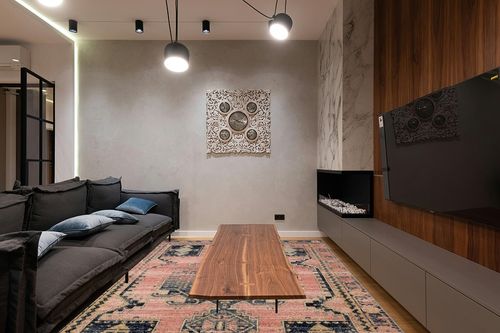 Loloi II Jocelyn Collection JOC-06 Rose/Rose 7'-10" x 10' Area Rug in Dark Wood Living Room with Black Couch