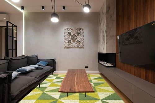 Antep Rugs Geometric 8x10 Modern Indoor Area Rug Siesta (Green, 7'10" x 10') in Dark Wood Living Room with Black Couch