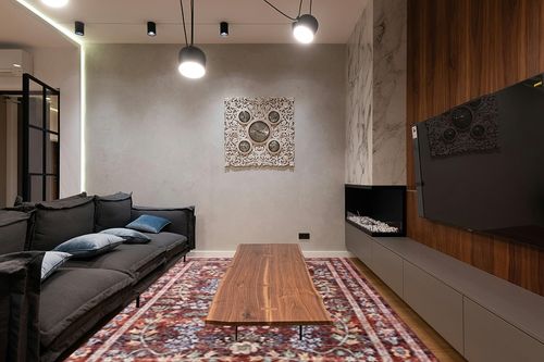 Loloi Rifle Paper Co. Maison Collection MAO-06 Red 8'-4" x 11'-6", .19" Pile Height, Area Rug in Dark Wood Living Room with Black Couch