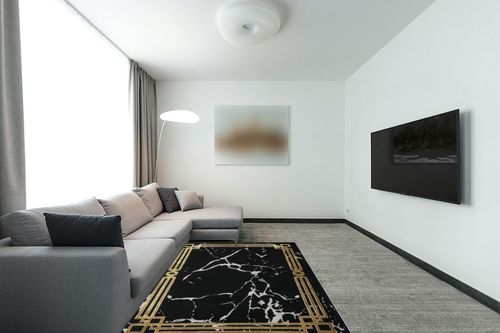 Antep Rugs Babil Gold 5x7 Abstract Marble Geometric Indoor Area Rug (Black, 5'3" x 7') in Modern Living Room with Grey Couch