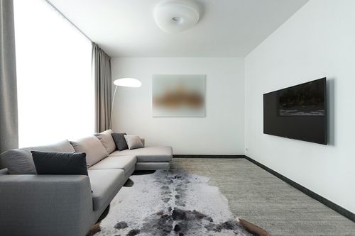 Faux Cowhide Rug Premium Cowhide Rug Large Cow Rug 8x6 Feet Rugs for Living Room Bedroom Dining Room Western Neutral Modern Rug Area Rugs Cow Print Rug Grey Rug Carpet in Modern Living Room with Grey Couch