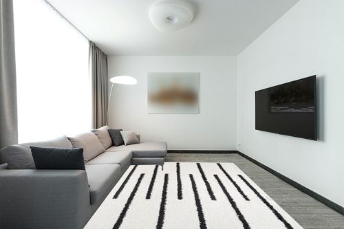 JONATHAN Y MOH402A-8 Alaro Berber Stripe Shag Indoor Area-Rug Bohemian Geometric Contemporary Glam Easy-Cleaning Bedroom Kitchen Living Room Non Shedding, 8 X 10, White/Black in Modern Living Room with Grey Couch