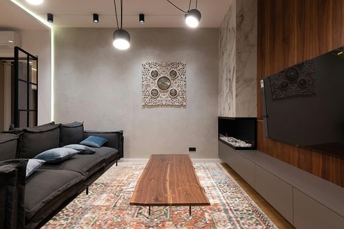 Loloi II Loren Terracotta/Sky 8'-4" x 11'-6" Area Rug in Dark Wood Living Room with Black Couch