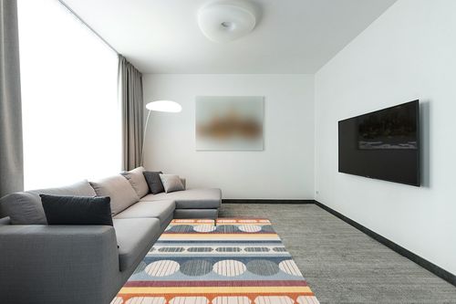 SAFAVIEH Orwell Collection Area Rug - 5'3" x 7'7", Blue & Yellow, Mid-Century Modern Design, Non-Shedding & Easy Care, Ideal for High Traffic Areas in Living Room, Bedroom (ORW367M) in Modern Living Room with Grey Couch