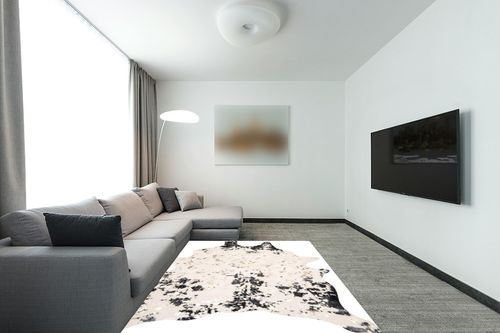 nuLOOM Iraida Contemporary Faux Cowhide Area Rug, 5' x 6' 7", Black in Modern Living Room with Grey Couch