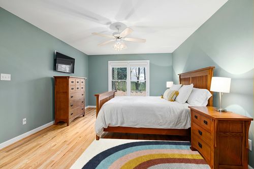 Sebuh Rainbow Area Rug Ebern Designs Rug Size: Rectangle 3'11" x 5'7" in Teal and Orange Wood Bedroom