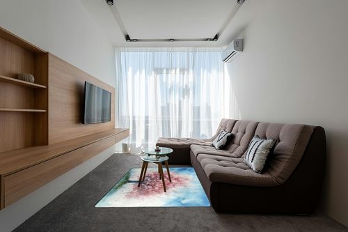 DNOVING Large Non-Slip Area Rug 5x7ft Washable Fluffy Rug, Cherry Blossom Tree Design, Rubber Backing, Pink and White Petals on Blue Sky in Grey Living Room with Brown Couch