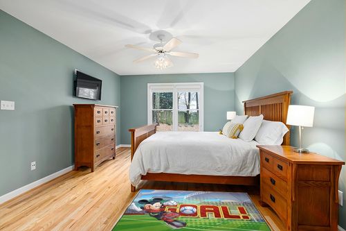 Jay Franco Disney Mickey Mouse Strike, Curve, Goal Kids Room Rug - Large Area Rug Measures 4 x 5 Feet (Offical Disney Product) in Teal and Orange Wood Bedroom