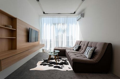 Home Must Haves Cowhide Rug, 6' x 7', Black and White in Grey Living Room with Brown Couch