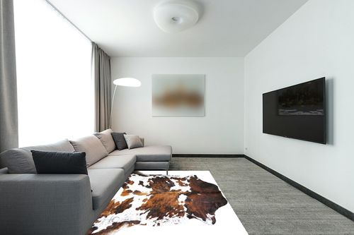 rodeo Genuine Cowhide Rug: Hand-Picked & Authentic Real Cowhide Rug for western Home Decor -TEXAS rug Cow Hide Rug Large Sized at 6x7ft - Rustic rug, Unique, Durable, Leather Cow Carpet Rugs -Tricolor in Modern Living Room with Grey Couch