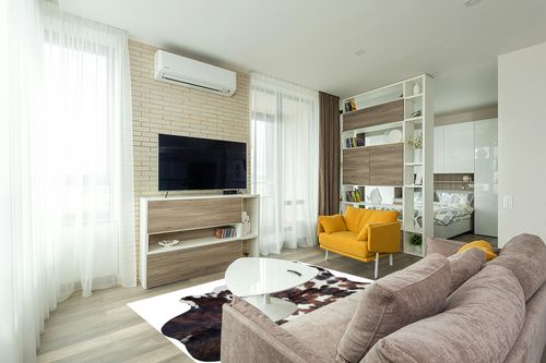 Sunshine Cowhides Genuine Tricolor Spotted Cowhide Rug - Luxurious Cow Rug for Bedroom, Living Room, and Home Decor Enthusiasts - Masterpiece of Style and Functionality - 6x6-7ft (180x210cm) in Light Modern Living Room with TV