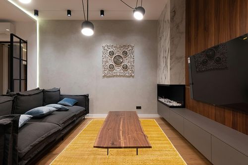 Unique Loom Finsbury Collection Area Rug - Kate (6' 1" x 9' Rectangle, Yellow) in Dark Wood Living Room with Black Couch