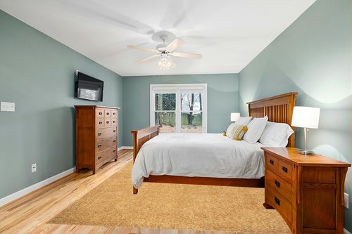 Belleza Shag Area Rug in Teal and Orange Wood Bedroom