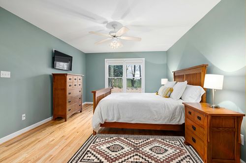 nuLOOM Leighton Machine Washable Southwestern Medallion Area Rug, 4x6, Beige in Teal and Orange Wood Bedroom