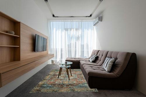 Loloi II Skye SKY-07 Terracotta / Sky Area Rug 6' x 9' in Grey Living Room with Brown Couch