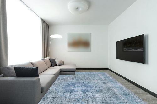 SAFAVIEH Tucson Collection Area Rug - 9' x 12', Green & Green, Persian Design, Non-Shedding Machine Washable & Slip Resistant Ideal for High Traffic Areas in Living Room, Bedroom (TSN190X) in Modern Living Room with Grey Couch