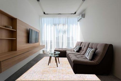 Unique Loom Revival Collection Traditional Medallion Border Yellow/Ivory Area Rug (7' 6 x 10' 6) in Grey Living Room with Brown Couch